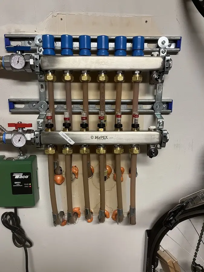 Plumber performing Water Heater Repair at a residential property in Benton